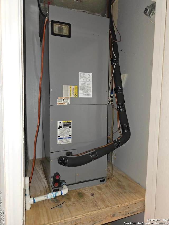 utility room with heating unit