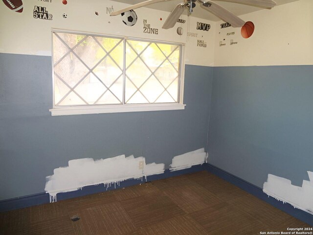 empty room with plenty of natural light and ceiling fan