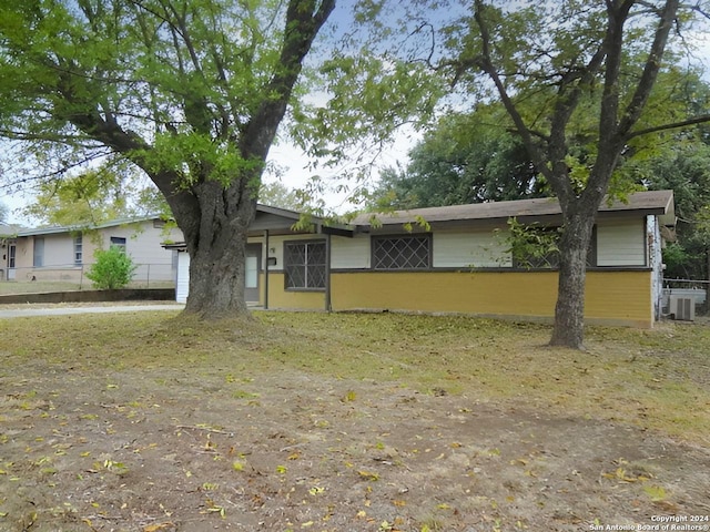 ranch-style home featuring central AC