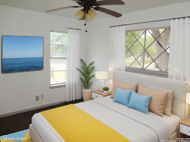 bedroom with ceiling fan and multiple windows