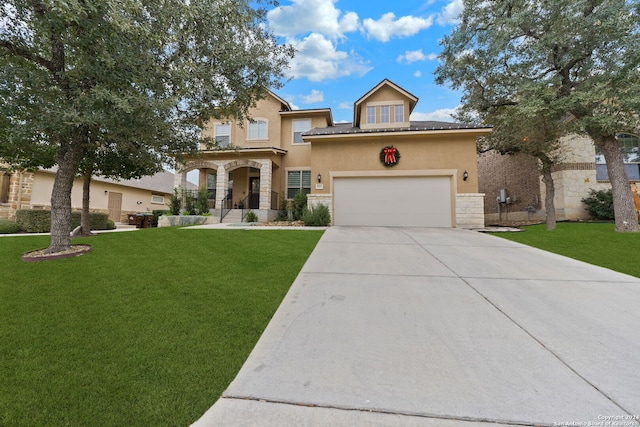 view of front of home featuring a garage and a front lawn