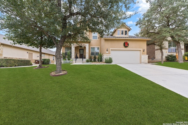 view of front of house featuring a front yard and a garage