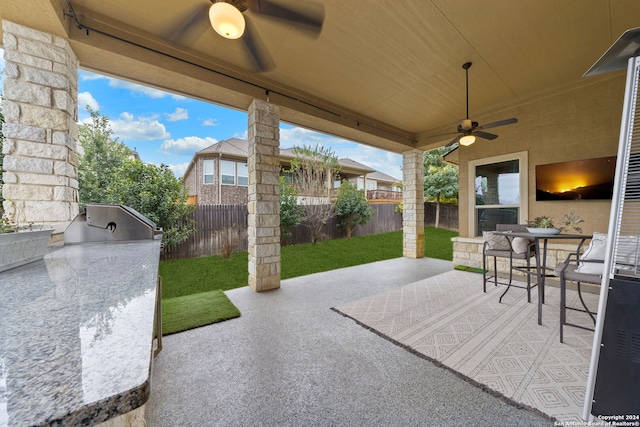 view of patio / terrace featuring ceiling fan