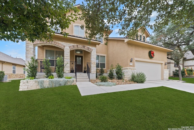 view of front of property featuring a front lawn and a garage