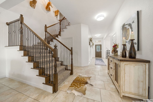 foyer featuring light tile patterned floors