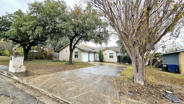 ranch-style house featuring a garage