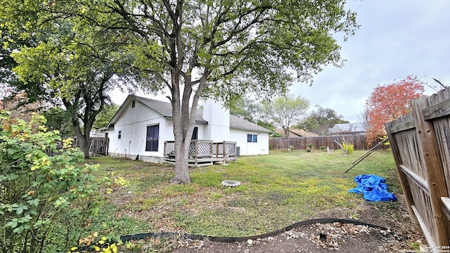 view of yard with a wooden deck