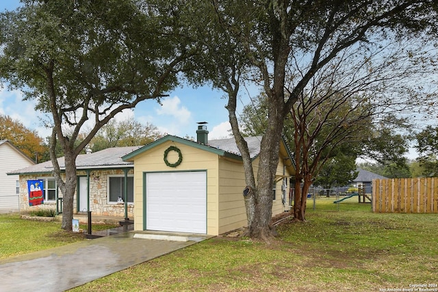 ranch-style house with a garage and a front yard