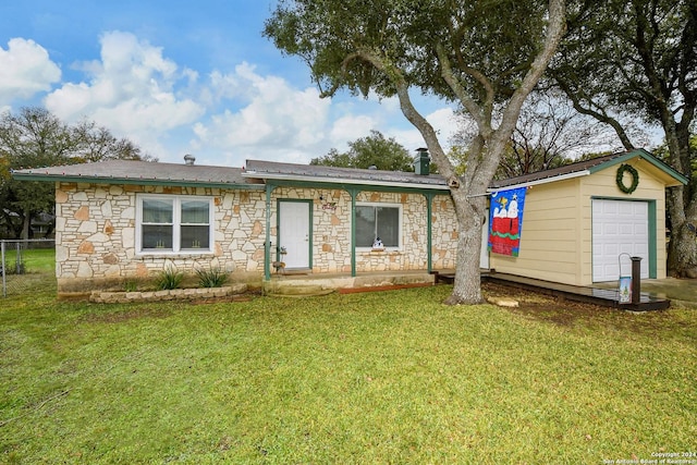 single story home with a garage and a front lawn