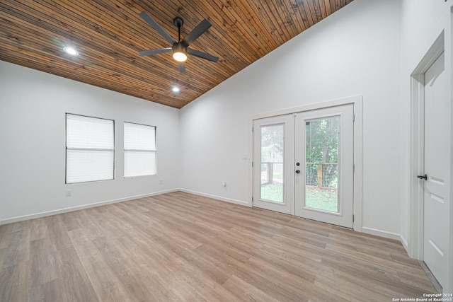 unfurnished room with ceiling fan, french doors, light hardwood / wood-style flooring, high vaulted ceiling, and wood ceiling