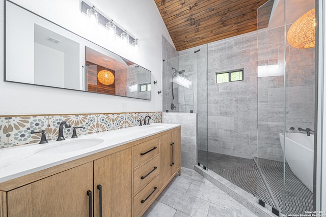 bathroom featuring vanity, tile walls, and shower with separate bathtub