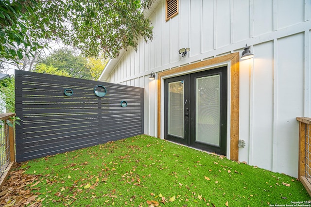 view of exterior entry featuring french doors