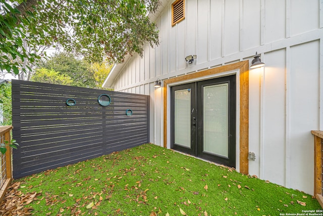 property entrance featuring french doors