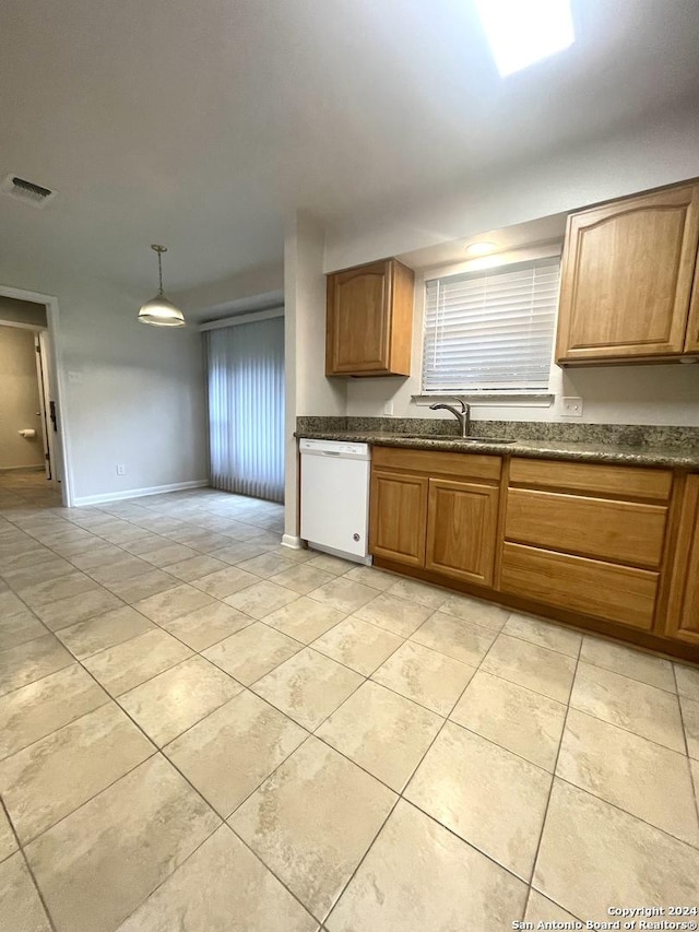 kitchen with dishwasher, decorative light fixtures, and sink