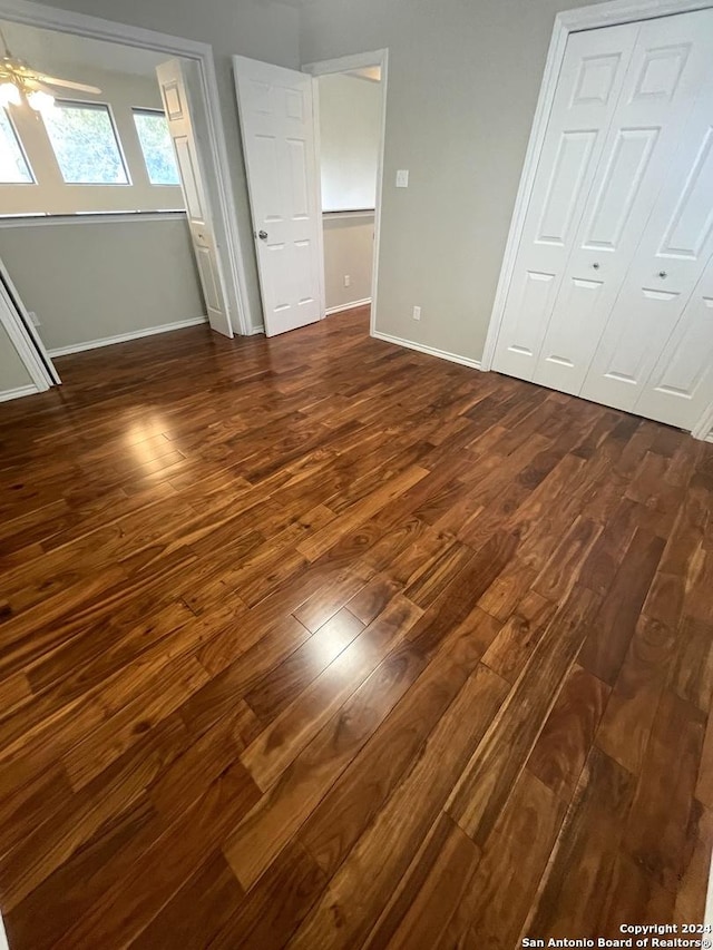 unfurnished bedroom featuring dark hardwood / wood-style flooring