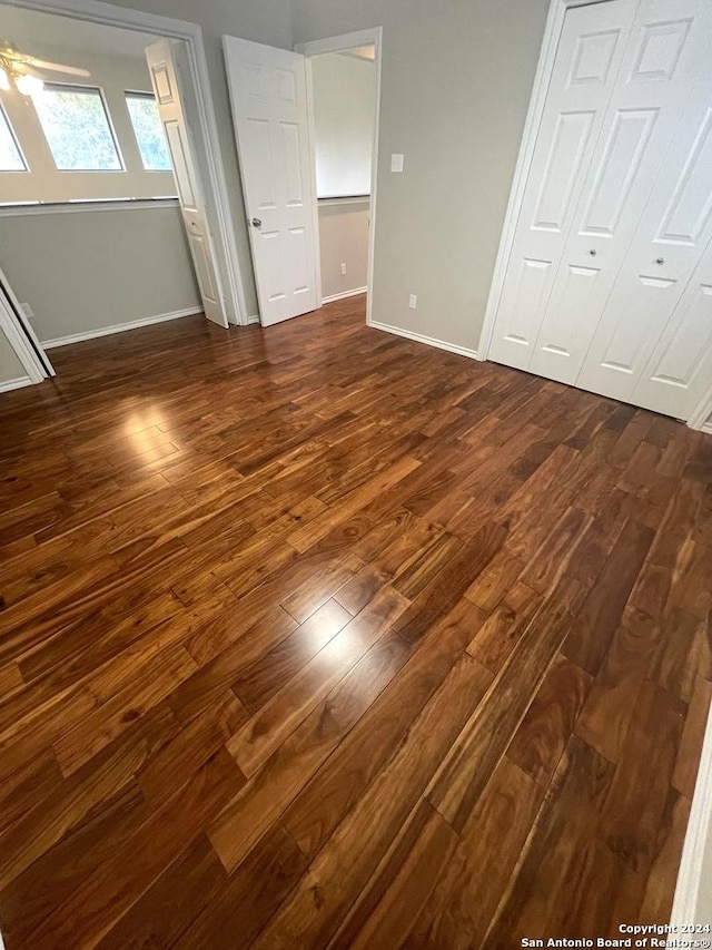 unfurnished bedroom featuring dark wood-type flooring