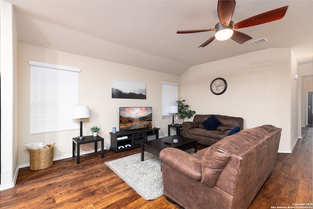 living room with dark hardwood / wood-style floors, ceiling fan, and lofted ceiling