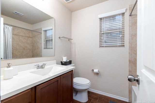 bathroom with vanity, a shower with shower curtain, toilet, a textured ceiling, and wood-type flooring