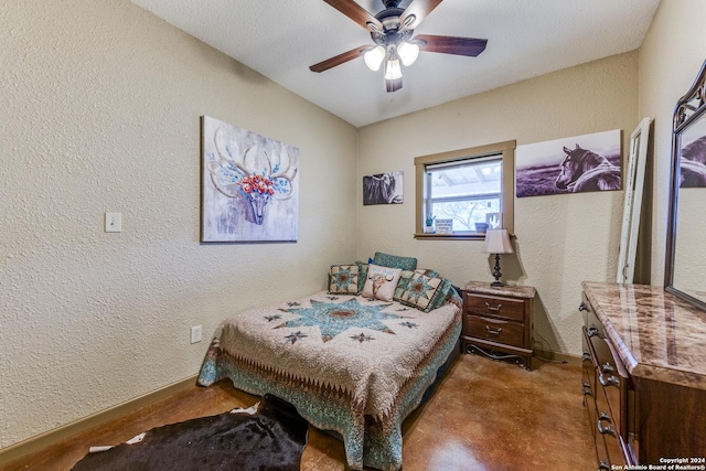 bedroom with a textured ceiling and ceiling fan