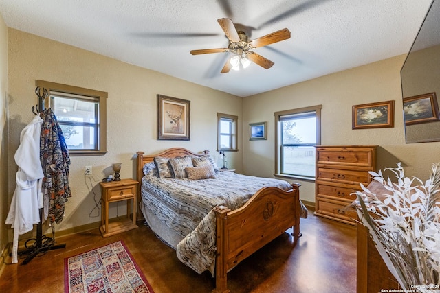 bedroom featuring a textured ceiling and ceiling fan