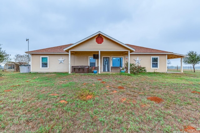 single story home with a front lawn