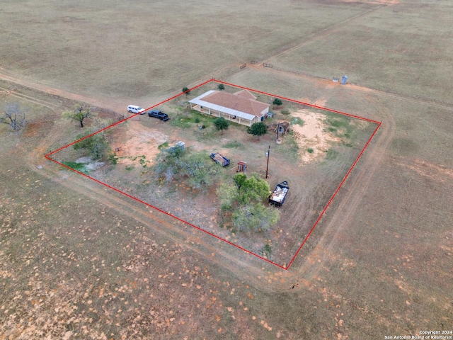 birds eye view of property with a rural view