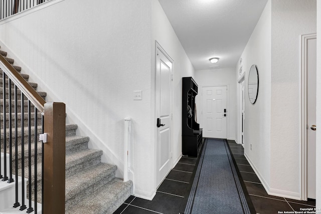 interior space featuring dark tile patterned floors