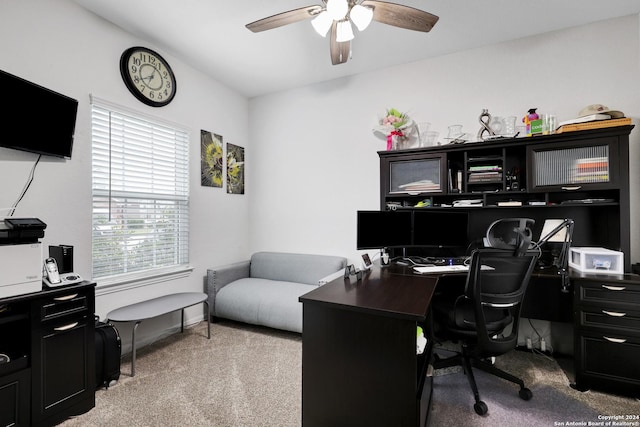 carpeted office featuring ceiling fan