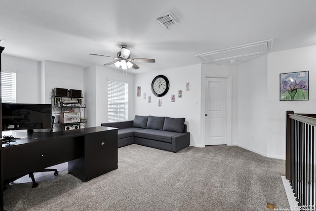 office space with light colored carpet, plenty of natural light, and ceiling fan