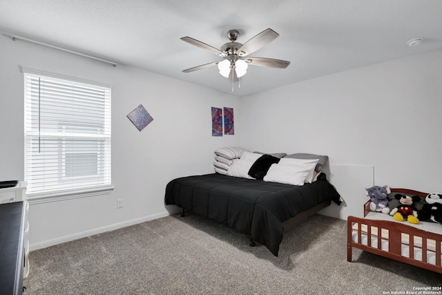 bedroom with carpet floors, multiple windows, and ceiling fan