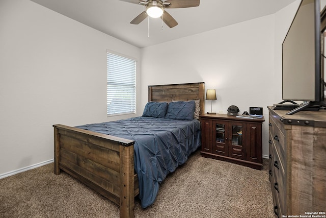 bedroom with ceiling fan and light colored carpet