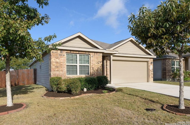 single story home featuring a front yard and a garage