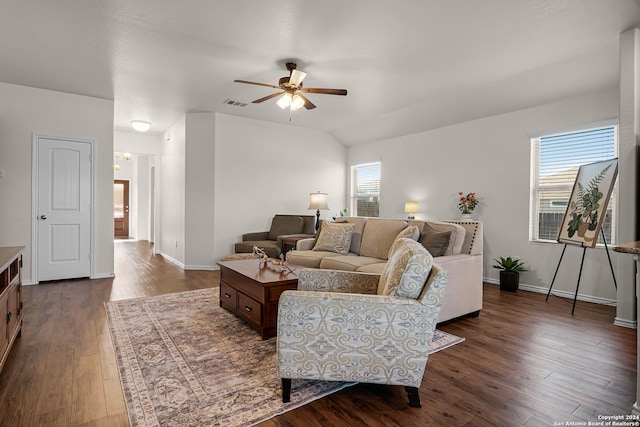 living room with ceiling fan, dark hardwood / wood-style flooring, and lofted ceiling