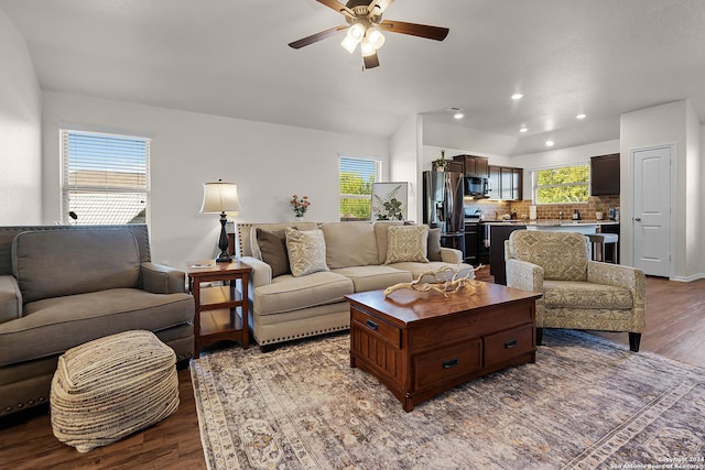 living room featuring ceiling fan and wood-type flooring