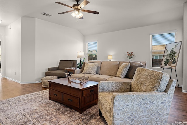 living room featuring vaulted ceiling, ceiling fan, plenty of natural light, and dark hardwood / wood-style floors