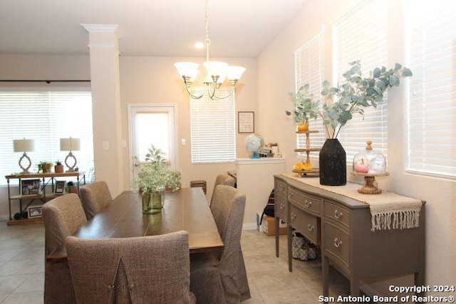 tiled dining area with an inviting chandelier