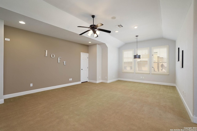 carpeted empty room with ceiling fan and vaulted ceiling