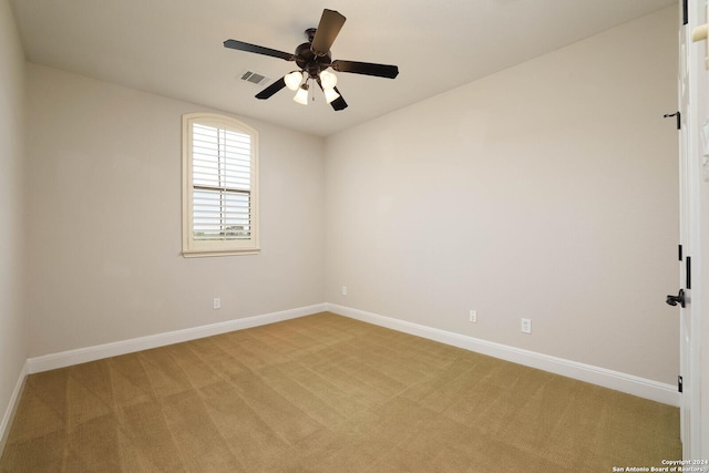 carpeted empty room with ceiling fan