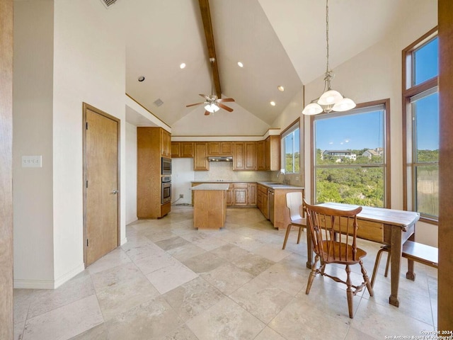 kitchen featuring high vaulted ceiling, beamed ceiling, decorative light fixtures, a kitchen island, and stainless steel appliances