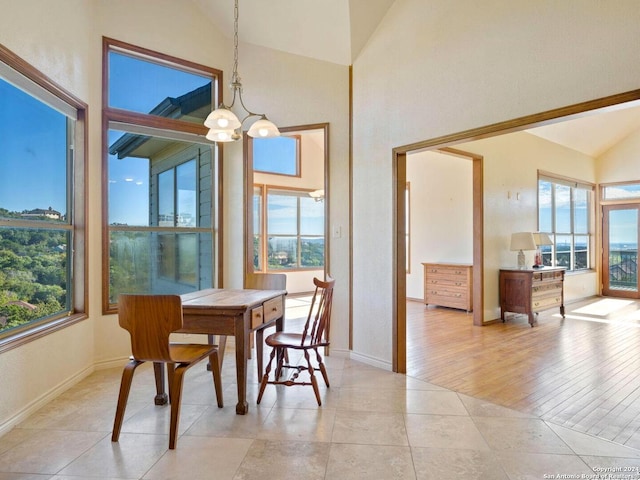 dining space featuring an inviting chandelier, light hardwood / wood-style flooring, and plenty of natural light