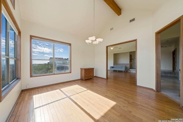 unfurnished dining area with beam ceiling, wood-type flooring, high vaulted ceiling, and an inviting chandelier