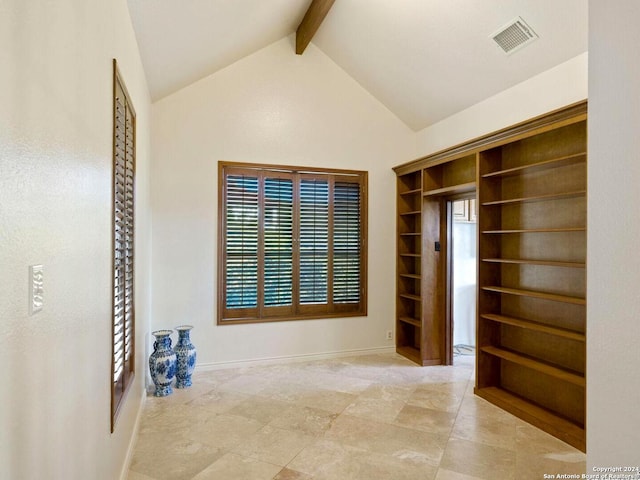 interior space featuring vaulted ceiling with beams and plenty of natural light