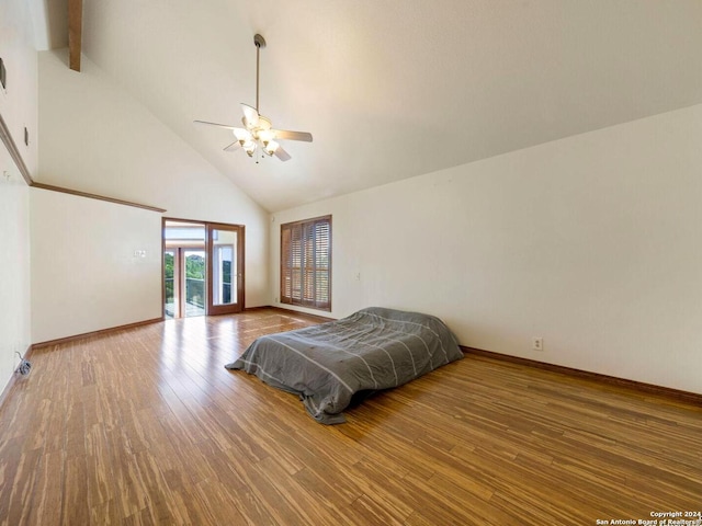 bedroom featuring beamed ceiling, hardwood / wood-style flooring, high vaulted ceiling, and ceiling fan