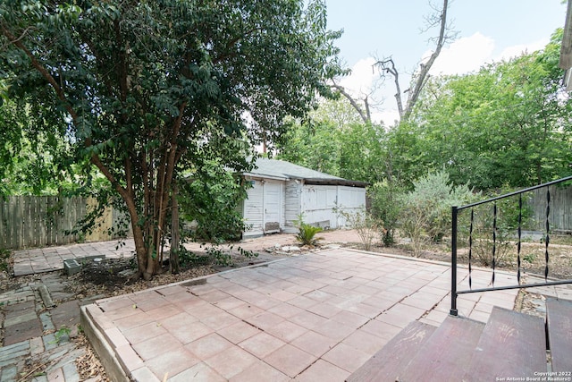 view of patio with an outdoor structure