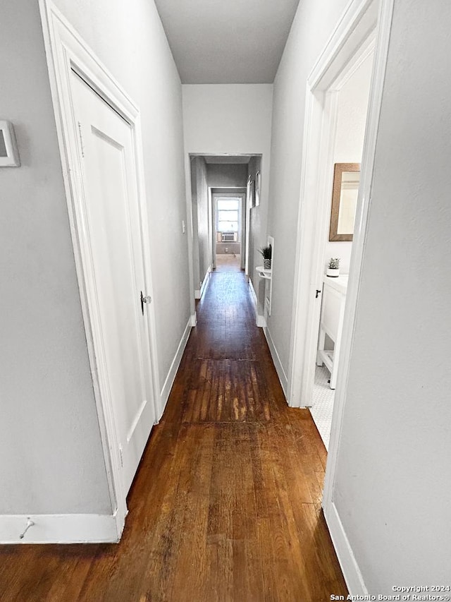 hall with dark hardwood / wood-style flooring