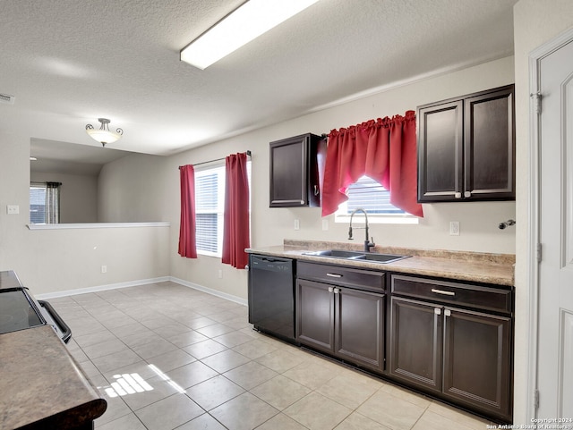 kitchen with light tile patterned flooring, dark brown cabinets, black dishwasher, and sink