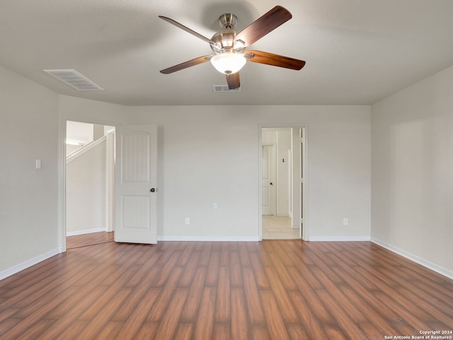 spare room featuring dark hardwood / wood-style flooring