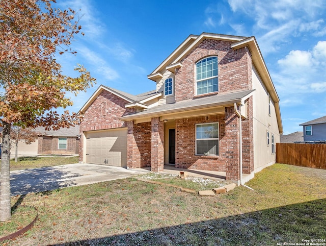 front of property with a garage and a front yard