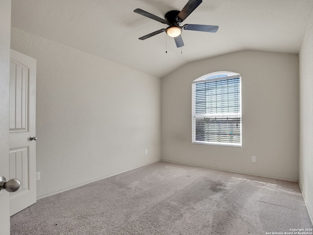 unfurnished room with light carpet, ceiling fan, and lofted ceiling