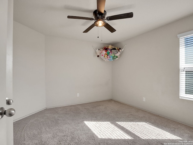 unfurnished room with carpet floors and ceiling fan